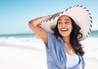 Happy stylish woman enjoy the beach with copy space
